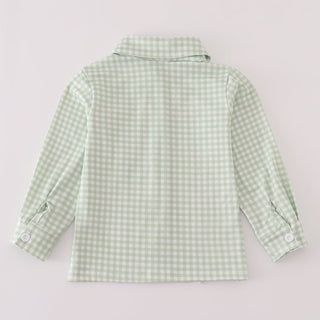 Green checkered shirt on a light gray background