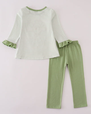 Green and white striped top with ruffled sleeves and green pants on a light gray background