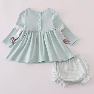 Light blue top with checkered bloomers on a light gray background