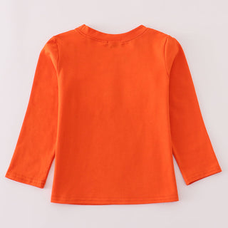 Orange long-sleeve shirt on a light gray background