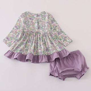 Floral dress with ruffled hem and matching bloomers on a white background