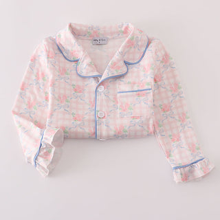 Floral pajama top with blue piping on a light gray background