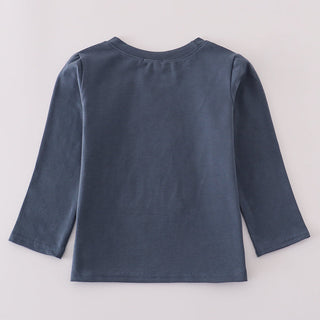 Blue long-sleeve shirt on a light gray background