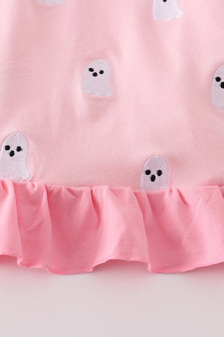 Pink fabric with ghost appliqués on a white background