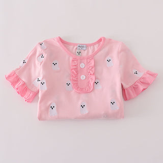 Pink girls shirt with ruffled sleeves and embroidered ghost details on a light gray background