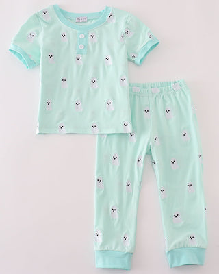 Children's pajama set with short sleeves and pants on a light gray background