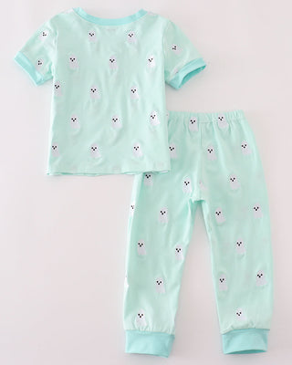 Children's pajama set with short-sleeve top and pants on a light gray background