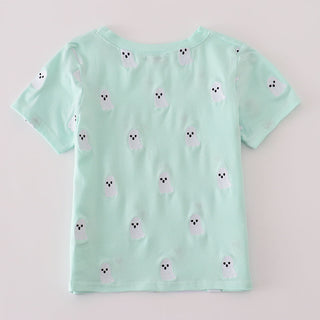 Light green t-shirt with small white animal prints on a light gray background