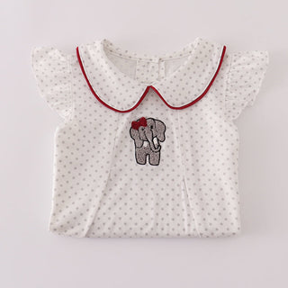 White baby top with red collar and elephant design on a light gray background