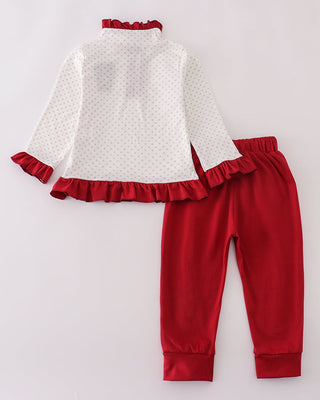 White top with red ruffles and matching red pants on a white background