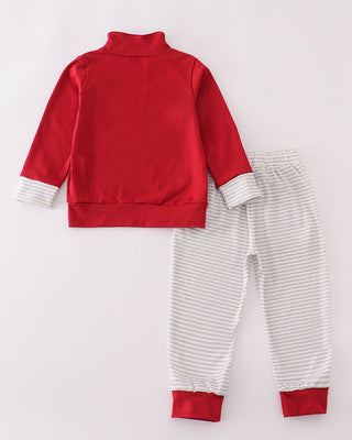 Red jacket and striped pants set on a white background