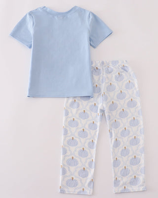 Light blue pants set with patterned pants on a light gray background