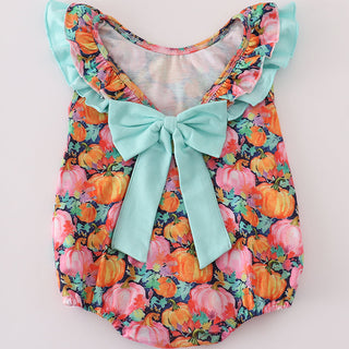 Colorful pumpkin baby romper with a bow on a white background