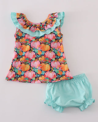 Baby set with bright pumpkin pattern and matching teal bloomers on a light gray background