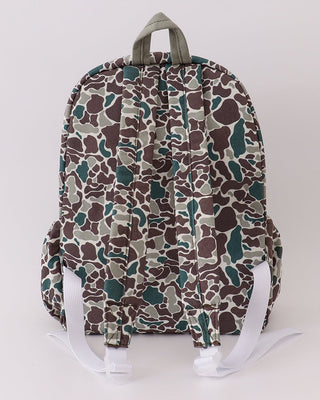 Camouflage-patterned backpack on a white background