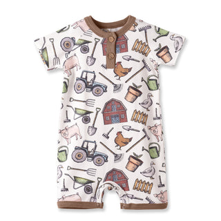 Baby romper with farm-themed pattern on a white background