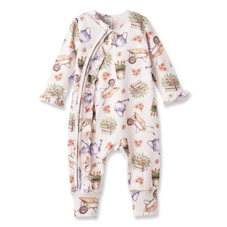 Baby onesie with gardening-themed print on a white background