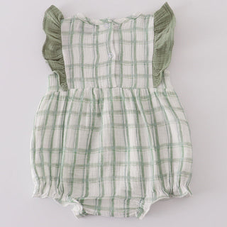 Green plaid baby romper with ruffled sleeves on a light gray background