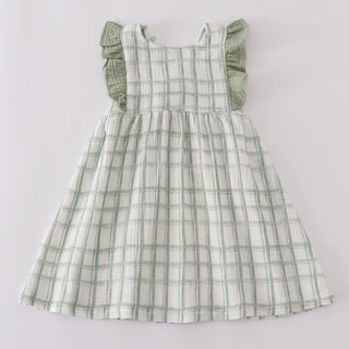 Green checkered dress on a light gray background