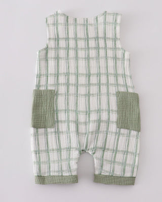 Green and white checkered baby romper on a light gray background