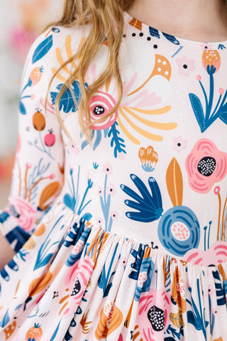 Close-up of a colorful floral dress with abstract patterns.