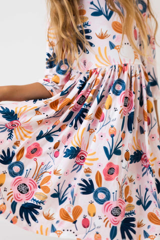 Floral dress with colorful patterns on a plain background