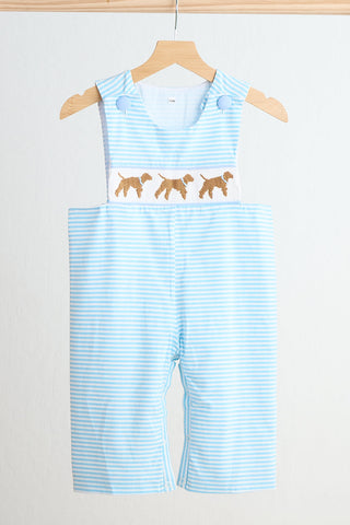 A blue and white striped toddler's jonjon with hand smocked puppy designs on the back.
