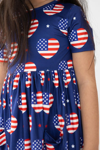 Navy blue dress with American flag pattern worn by a person