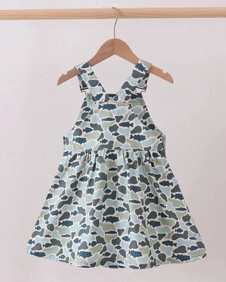 Children's dress with blue and green pattern on a hanger against a white background