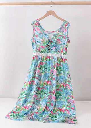 Floral dress on a hanger against a white background