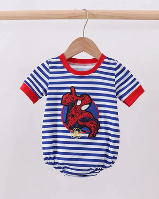Striped baby romper with a red and blue design on a wooden hanger against a white background