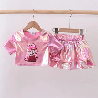 Pink iridescent crop top and shorts set on a hanger against a white background
