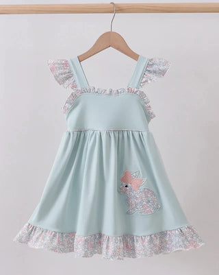 Light blue dress with floral details on a hanger against a white background