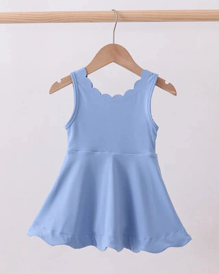 Light blue dress on a wooden hanger against a white background