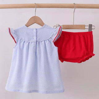 Baby bloomer set  with ruffled collar and red bloomers on a wooden hanger against a light background