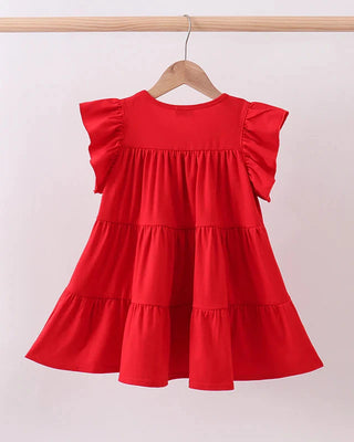 Red dress with ruffled sleeves on a hanger against a white background