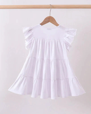 White dress on a hanger against a plain background