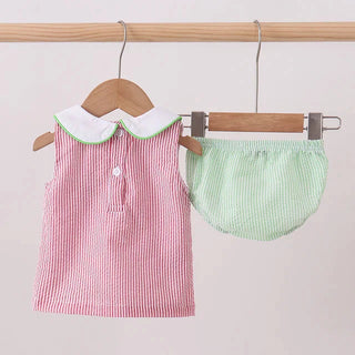 Red and white striped set with green checkered bloomers on a hanger against a light pink background