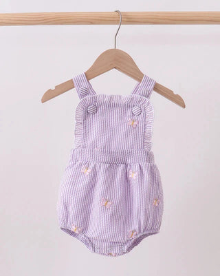 Purple striped baby romper with floral embroidery on a wooden hanger against a white background