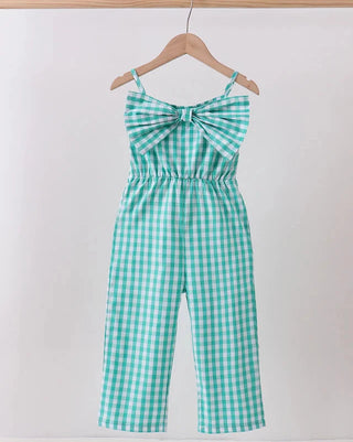 Green and white checkered jumpsuit on a hanger against a white background