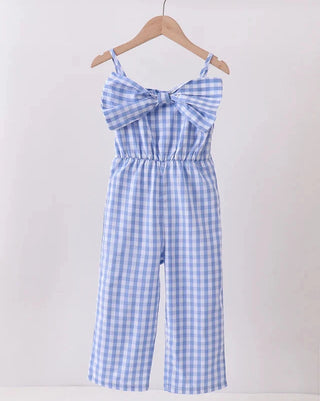 Blue and white checkered jumpsuit on a hanger against a white background