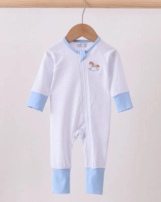 White baby onesie with blue accents on a hanger against a light background