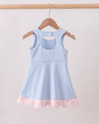 Light blue dress with pink lace trim on a wooden hanger against a white background