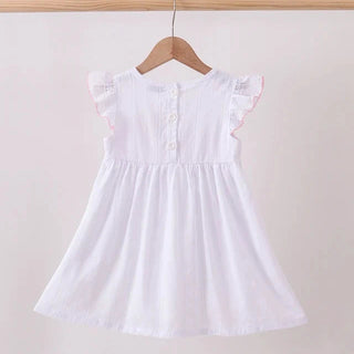 A white sleeveless dress with ruffled cap sleeves, a buttoned back, and a flared skirt, hanging on a wooden hanger against a plain light background.