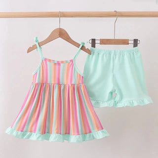 A two-piece toddler girl's outfit set hanging on wooden hangers against a plain light background. The set includes a sleeveless spaghetti-strap dress with pastel vertical stripes in pink, orange, yellow, green, and blue, and matching mint green ruffle-trimmed shorts.