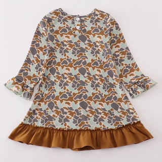 Patterned dress with a brown ruffled hem on a white background