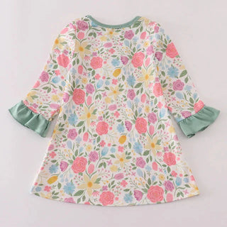 Floral dress with ruffled sleeves on a light gray background