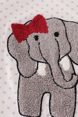 Gray elephant with a red bow on a white background