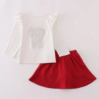 White long-sleeve top with a red skirt on a light gray background