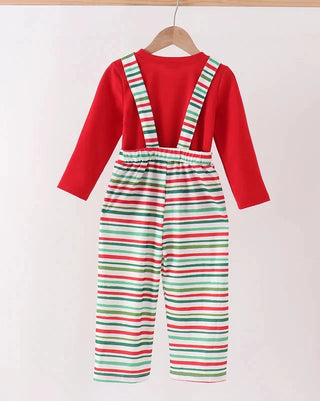 A children's long-sleeve jumpsuit hanging on a wooden hanger against a plain light background. The top is solid bright red, while the bib and pants sections feature horizontal stripes in red, green, and white.